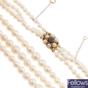 A cultured pearl three-row necklace, with 9ct gold garnet cluster clasp.