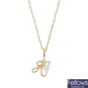 MIKIMOTO - a cultured pearl initial pendant, with chain.
