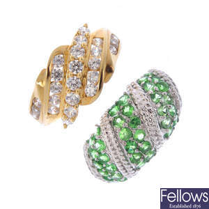 Four gold cubic zirconia, diamond and gem-set rings.