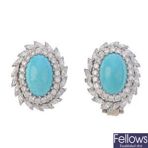 A pair of turquoise and diamond earrings.