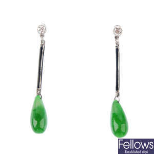 A pair of emerald and black enamel earrings.