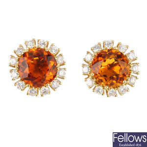 A pair of citrine and diamond cluster earrings.