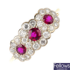 An 18ct gold ruby and diamond triple cluster ring.