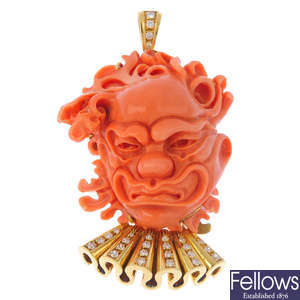 A coral and diamond novelty pendant.
