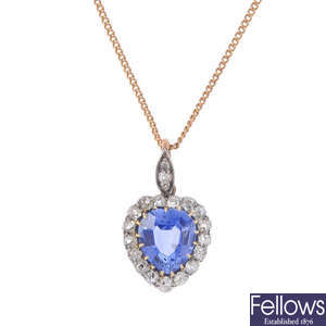 A Ceylon sapphire and diamond pendant, with chain.