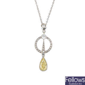 A Fancy Intense Yellow diamond and diamond pendant.