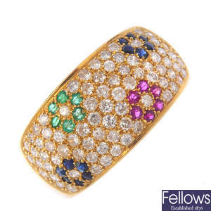 An 18ct gold diamond, emerald, ruby and sapphire floral band ring. 