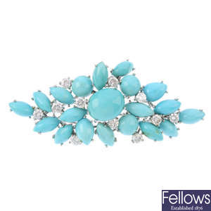 A turquoise and diamond brooch.