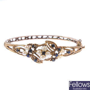 A 9ct gold sapphire and cultured pearl hinged bangle.