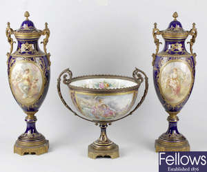A pair of 19th century 'Chateau des Tuileries' Sevres style twin handled vases and covers
