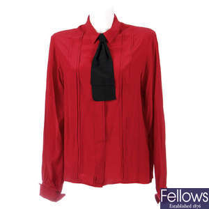 CHANEL - a red silk blouse.