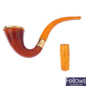 A natural amber pipe and cheroot.