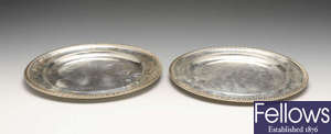 A set of eight modern silver plates.