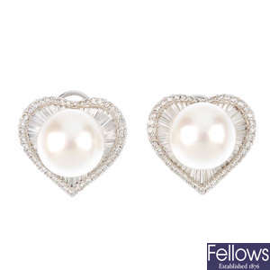 A pair of cultured pearl and diamond heart earrings.
