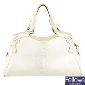 CARTIER - a white leather Marcello De Cartier handbag.
