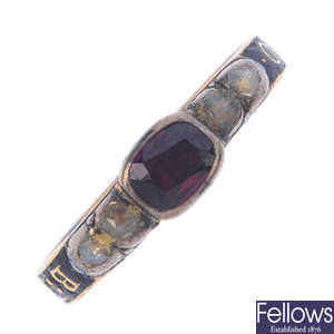 A George I gold diamond, foil-back garnet and enamel memorial ring.