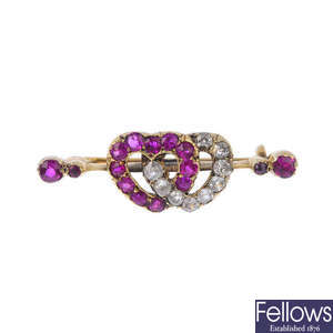 A late Victorian gold synthetic ruby and diamond double heart brooch, circa 1890.