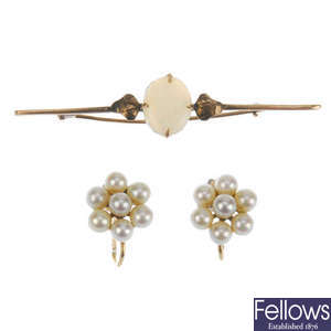 An early to mid 20th century gold brooch and earrings and a selection of novelties.