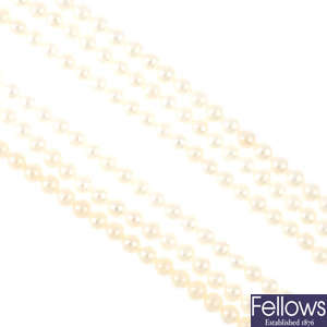 A cultured pearl three-row necklace.