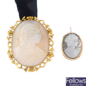 A mother-of-pearl cameo and an abalone cameo brooch.