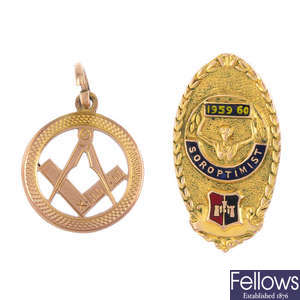 A Masonic pendant and a Soroptimist brooch.