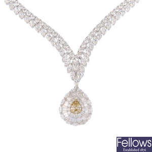 A 'yellow' diamond and diamond necklace.