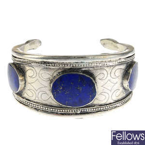 A lapis lazuli ring and bangle with a pair of earrings.