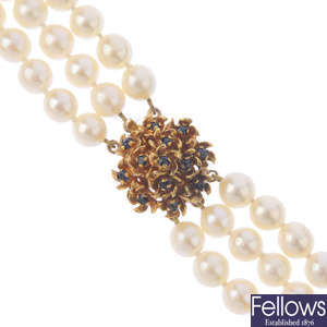 A cultured pearl three-row necklace, with 9ct gold sapphire clasp.