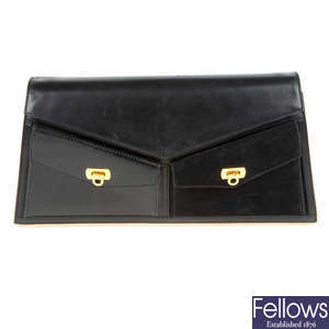 SALVATORE FERRAGAMO - a black leather envelope handbag.