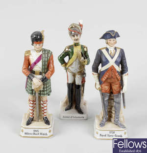 A group of eight Continental porcelain military figures, plus four prints.