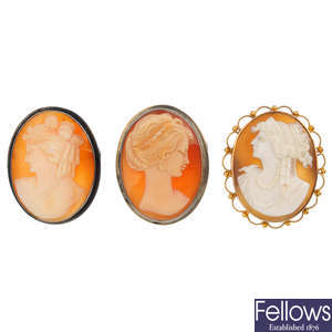 Four shell cameo brooches and a selection of costume jewellery.