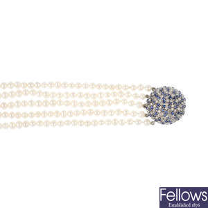 A cultured pearl, diamond and sapphire bracelet.
