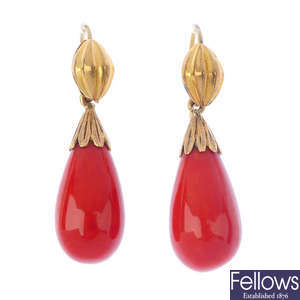 A pair of dyed coral earrings.