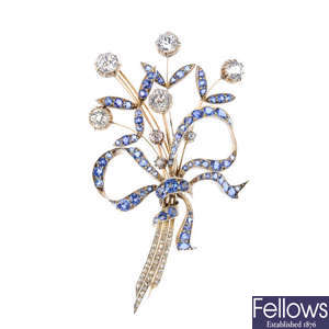 A sapphire and diamond brooch.