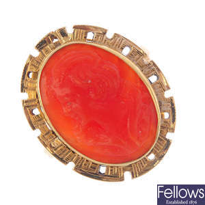 A coral cameo ring.