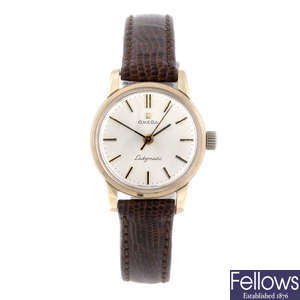 OMEGA - a lady's 9ct yellow gold Ladymatic wrist watch with two Omega watches.