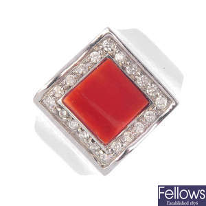 A coral and diamond dress ring.