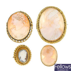 Four cameo brooches.