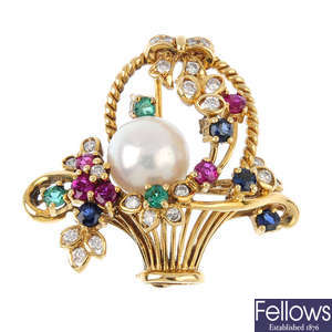 An 18ct gold diamond and gem-set floral brooch.