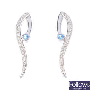 A pair of 18ct gold topaz and diamond earrings.