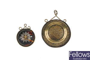 Two late 19th to early 20th century tortoiseshell pique pendants.