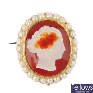 A late Victorian gold, sardonyx cameo and split pearl brooch.