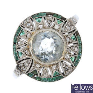 An Art Deco aquamarine, diamond and emerald dress ring.
