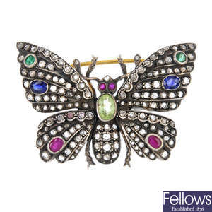 A diamond and gem-set butterfly brooch.
