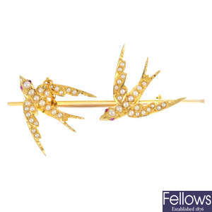 An early 20th century seed pearl swallow bar brooch.