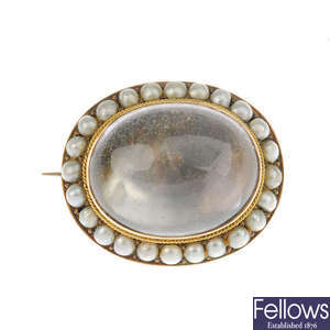 A late Victorian split pearl and later added rock crystal cabochon brooch.