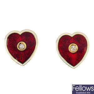 A pair of diamond and enamel heart earrings.