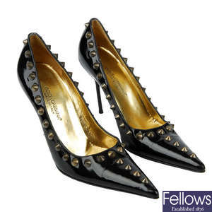 DOLCE & GABBANA - a pair of black patent leather spike stilettos.