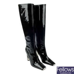 LOUIS VUITTON - a pair of knee-high black patent leather boots.
