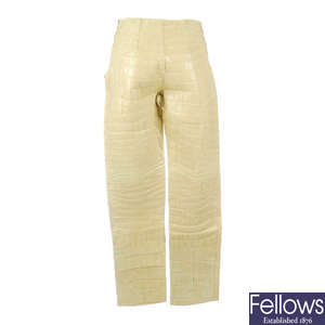 TRUSSARDI - a pair of beige crocodile leather trousers.